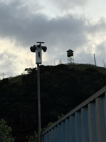 P2P camera node on pole with watchtower visible on hillside